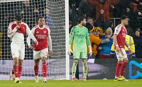Arsenal players look dejected after conceding a late equalizer against Wolves
