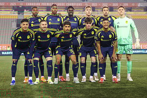Nashville SC players pose for a team photo against Atletico Ottawa