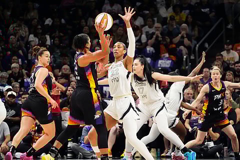 Phoenix Mercury and Las Vegas Aces players in action during the WNBA