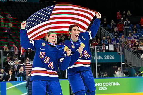 Hilary Knight celebrates winning the Gold Medal with teammate