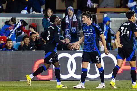 Daniel Munie celebrates a goal with Jamar Ricketts