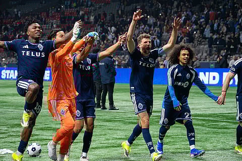 Vancouver Whitecaps players celebrate after winning against Real Salt Lake
