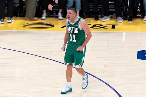 Payton Pritchard celebrates a pointer against Los Angeles Lakers