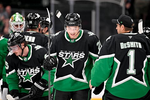 Dallas Stars left wing Jason Robertson celebrates his goal with teammates