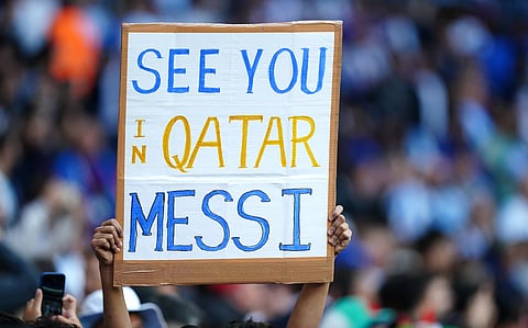 An Argentine fan raises a poster in the stands
