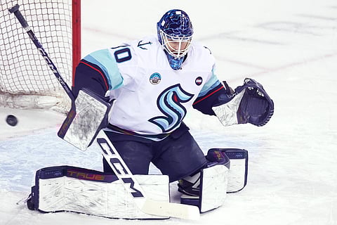 Seattle Kraken goalie Ales Stezka goes down to make a save