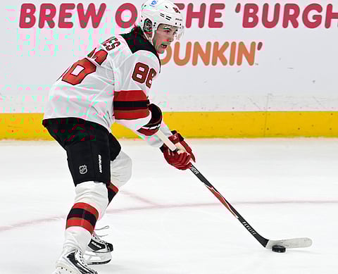 New Jersey Devils center Jack Hughes in action