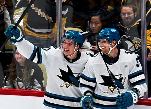 San Jose Sharks players celebrate a goal 