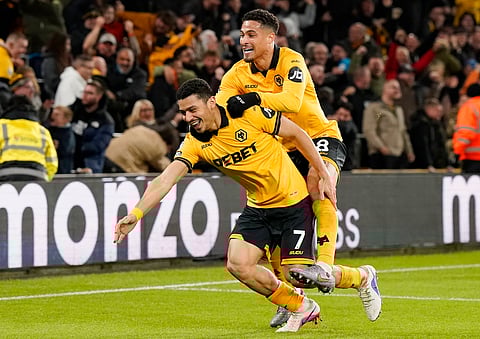 Andre celebrates after scoring the winning goal with Joao Gomes