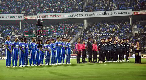 India and New Zealand squads stand for the national anthems