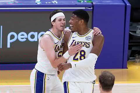 Rui Hachimura celebrates with Austin Reaves