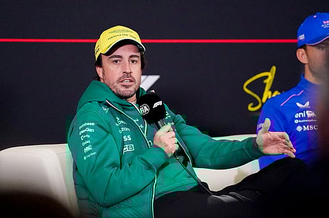 Fernando Alonso speaks to the media