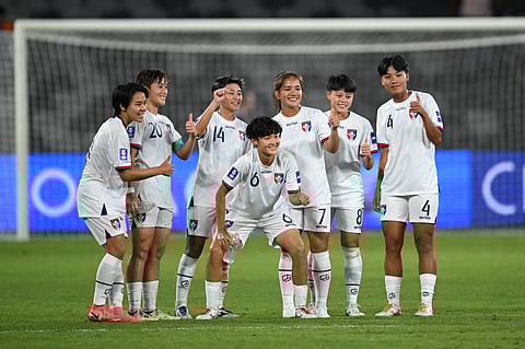 Taiwan players pose for a photo after win over India