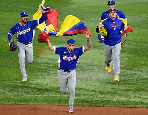 Venezuela players celebrate their win over Italy