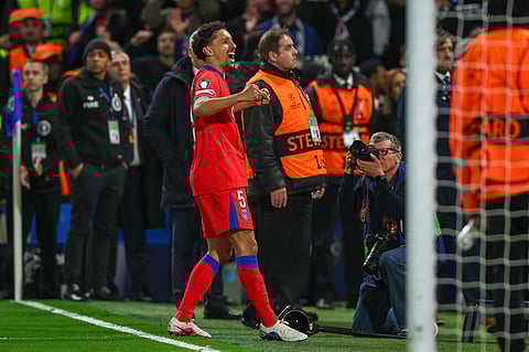 Marquinhos applauds the away fans at Stamford Bridge