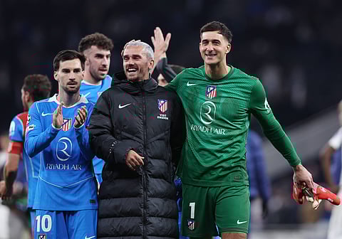 Atletico Madrid players celebrate after moving to the quarter-finals 