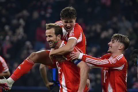 Harry Kane celebrates his goal with teammates