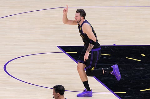 Luka Doncic celebrates after scoring a basket 