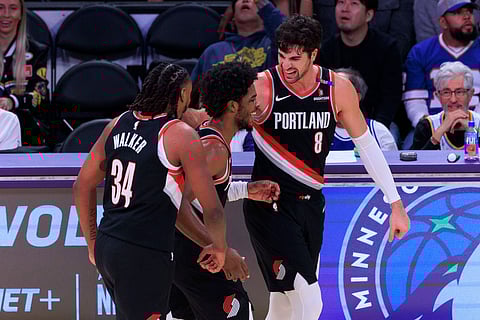 Portland Trail Blazers players celebrate a point