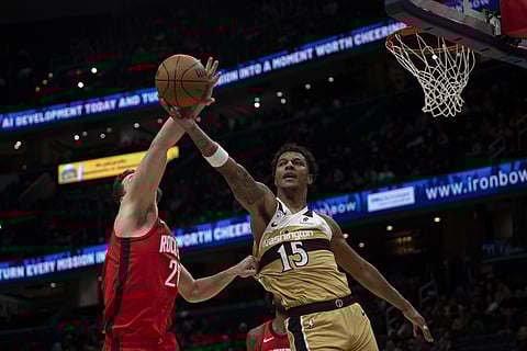 Julian Reese challenges for the ball