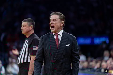 Rick Pitino gestures from the sideline