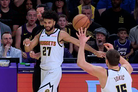 Jamal Murray and Nikola Jokic in action