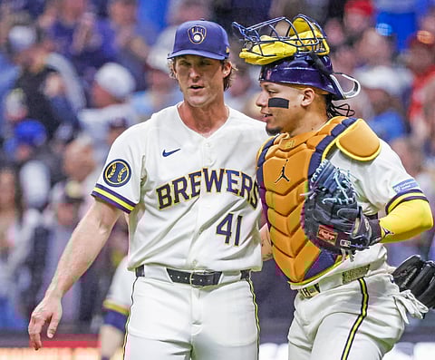 Milwaukee Brewers players celebrate after the final out 