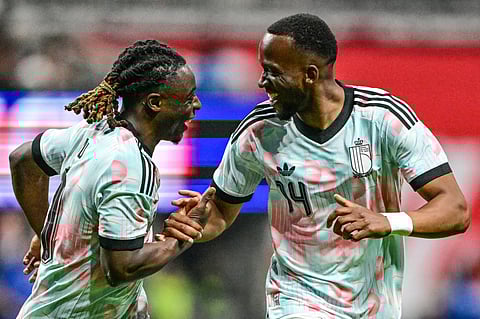 Jeremy Doku and Dodi Lukebakio celebrate goal against USA