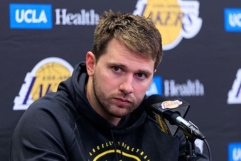Luka Doncic attens a prss conference 
