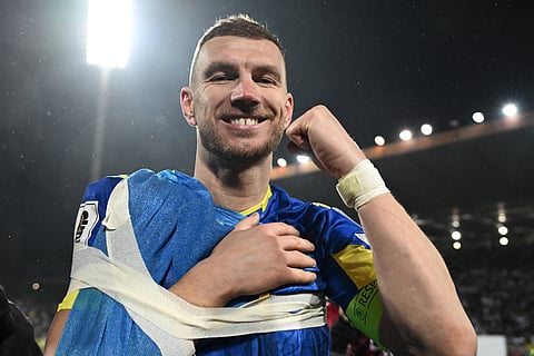 Edin Džeko celebrates at full time as Bosnia and Herzegovina qualify for the FIFA World Cup