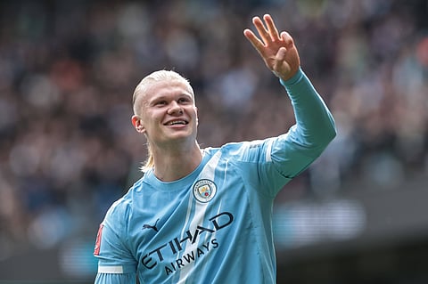 Erling Haaland celebrates his hat-trick against Liverpool