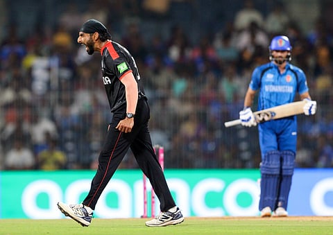 Jaskaran Singh celebrates taking a wicket in the T20 World Cup