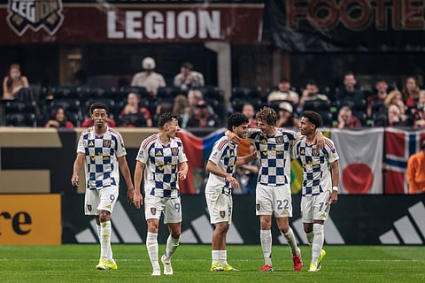 Real Salt Lake players celebrate a goal against Sporting Kansas City