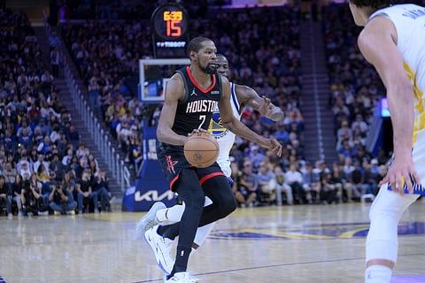 Kevin Durant drives forward with the ball