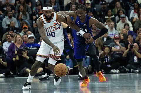 Royce O'Neale drives forward with the ball 