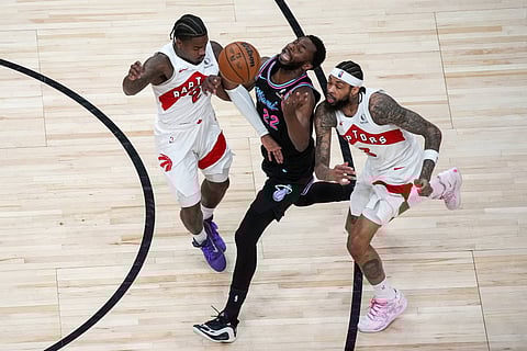 Toronto Raptors and Miami Heat players in action