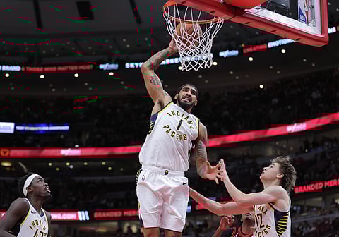 Obi Toppin attempts a dunk 