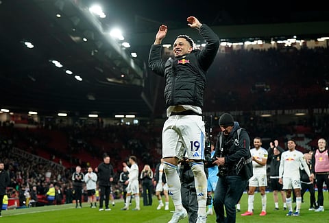 Noah Okafor celebrates with the away fans at full-time