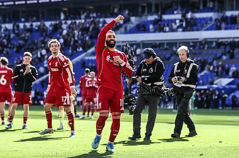 Mohamed Salah applauds the away fans at the Hill Dickinson Stadium