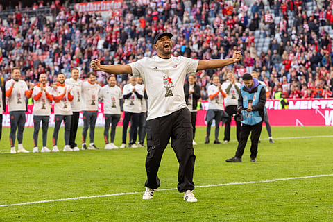 Bayern Munich coach and players celebrate after winning the Bundesliga