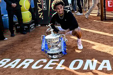 Arthur Fils poses with the winners trophy