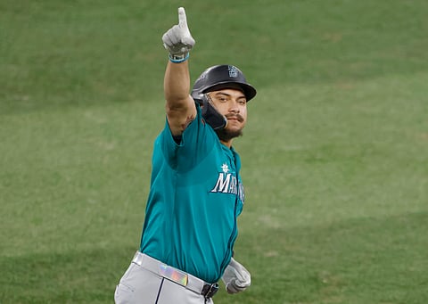 Josh Naylor reacts after hitting a home run
