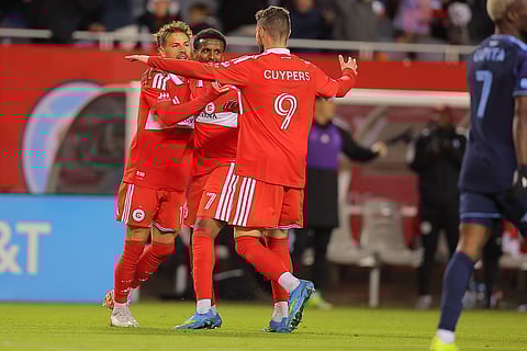 Chicago Fire celebrates after scoring against Sporting Kansas City