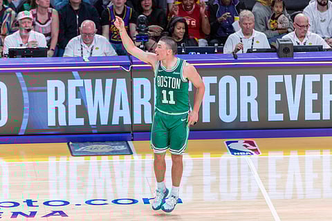 Payton Pritchard celebrates after hitting a three-pointer 