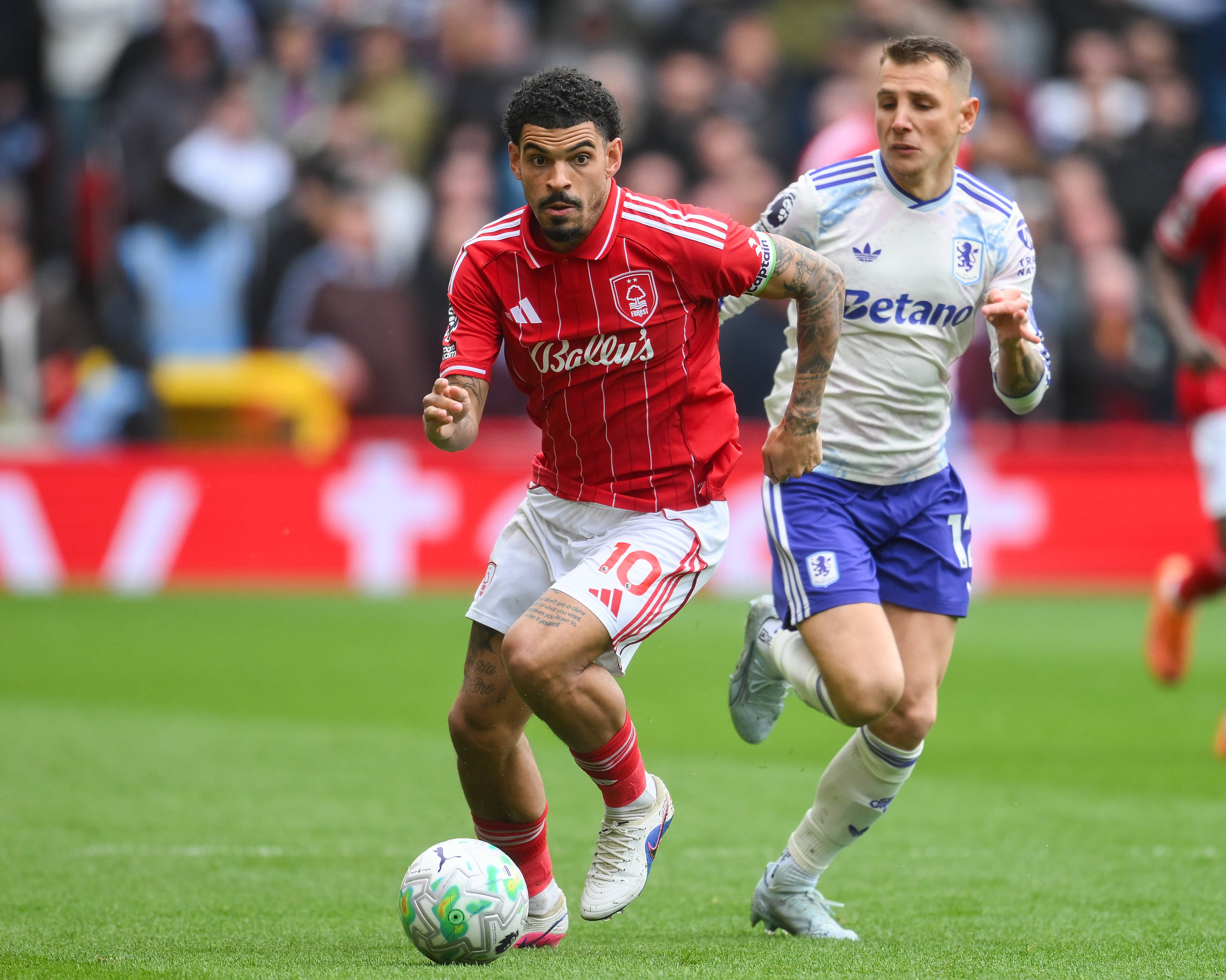 Aston Villa and Nottingham Forest players in action in the Premier League