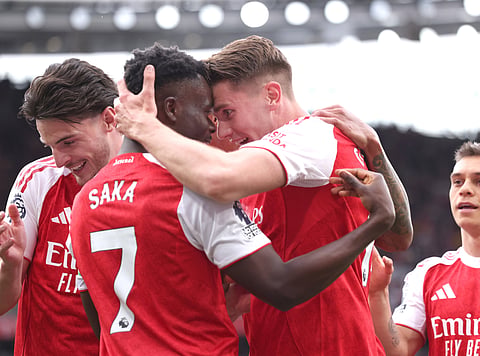 Viktor Gyokeres celebrates with Bukayo Saka