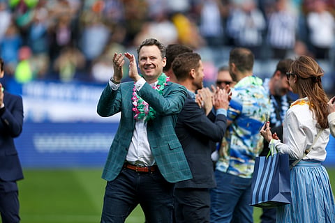 Sheffield Wednesday owner Tom Costin applauds the fans