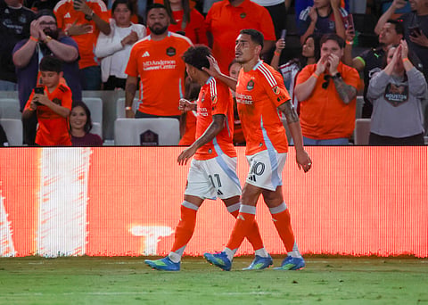 Lawrence Ennali celebrates his goal with Ezequiel Ponce