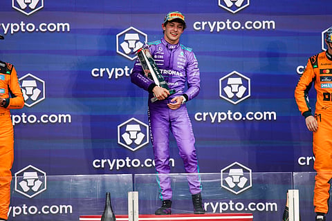 Kimi Antonelli poses with the trophy