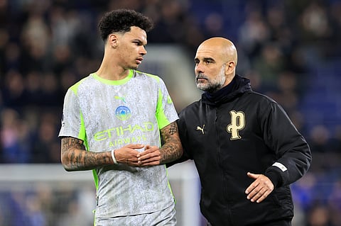 Pep Guardiola with Nico O'Reilly at full-time
